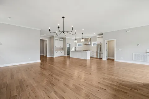 a view of kitchen and dining room with wooden floor