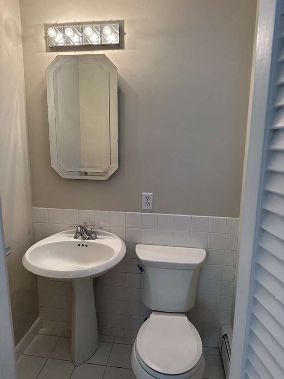 19 Merrill Drive Framingham, MA 01701 - Photo 6 of 18 a bathroom with a toilet sink and mirror