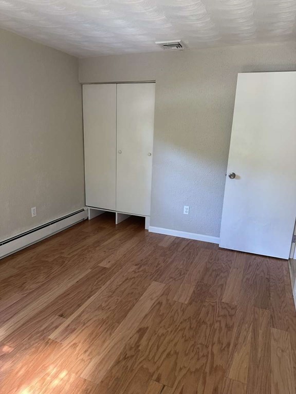 19 Merrill Drive Framingham, MA 01701 - Photo 7 of 18 a view of an empty room with wooden floor