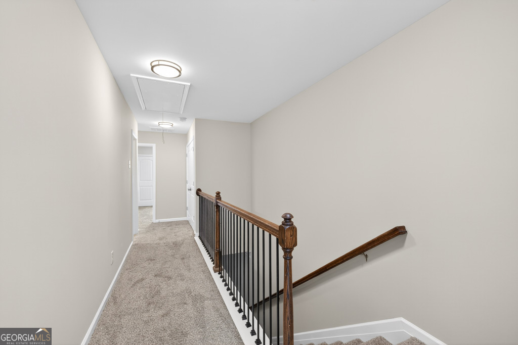 1734 Snapping Court Winder, GA 30680 - Photo 14 of 35 a view of a hallway with wooden floor