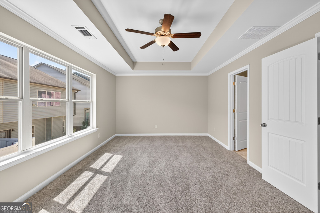 1734 Snapping Court Winder, GA 30680 - Photo 16 of 35 a view of an empty room with a window and a ceiling fan