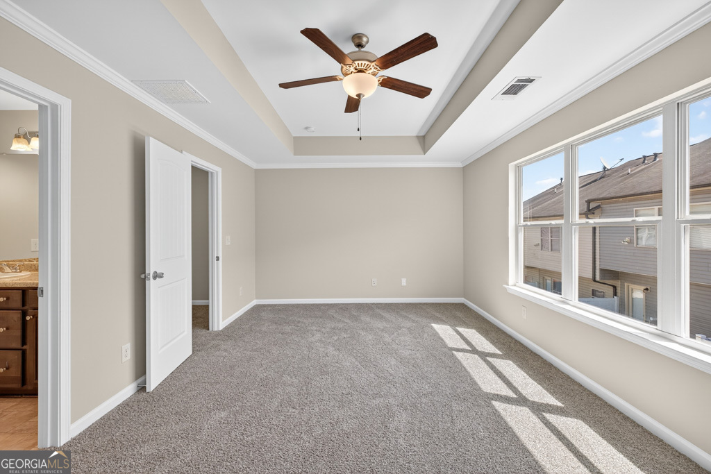 1734 Snapping Court Winder, GA 30680 - Photo 17 of 35 an empty room with window and a ceiling fan