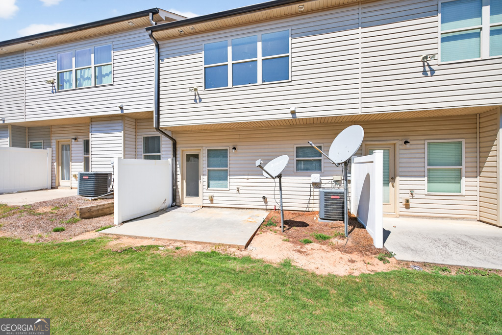 1734 Snapping Court Winder, GA 30680 - Photo 31 of 35 a front view of a house with a yard and seating space
