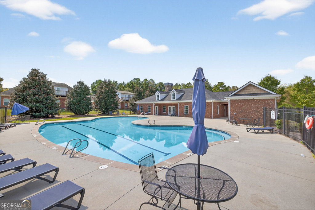 1734 Snapping Court Winder, GA 30680 - Photo 34 of 35 a front view of a house with garden space and patio