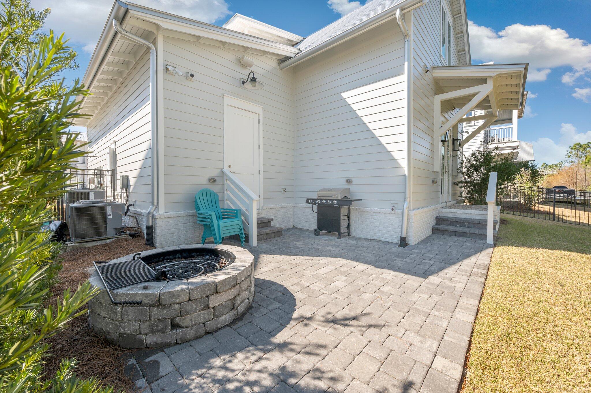 64 White Cottage Road Santa Rosa Beach, FL 32459 - Photo 17 of 28 a view of a patio with couches and potted plants
