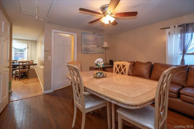 a kitchen with stainless steel appliances granite countertop a stove a refrigerator a table and chairs