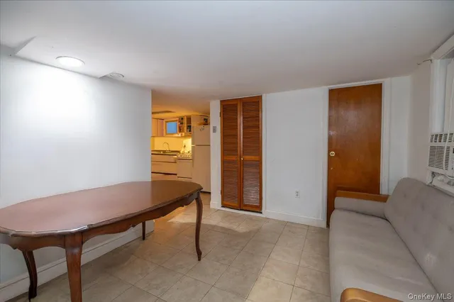 a room with furniture and a potted plant