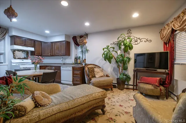 a living room with furniture and a dining table with wooden floor