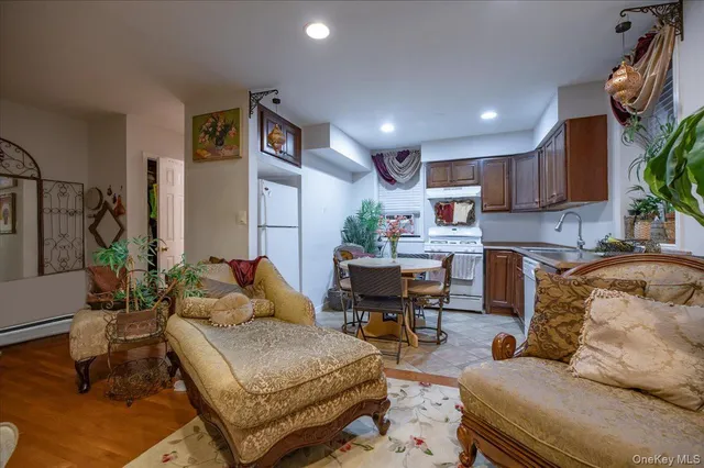 a bedroom with furniture and a potted plant