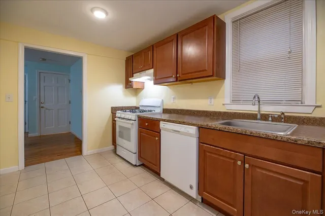 a bathroom with a sink toilet vanity and tub