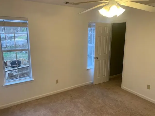 a view of a hallway with a chandelier