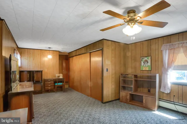 a bathroom with a sink mirror and toilet