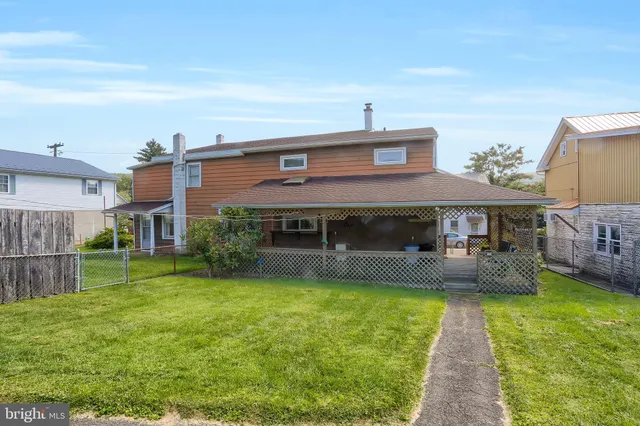 a front view of house with yard and seating area