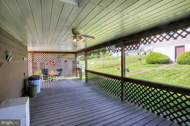 a view of a patio with wooden floor