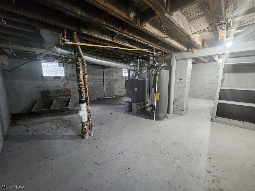 13417 Rugby Road Cleveland, OH 44110 - Photo 24 of 26 Basement featuring water heater and heating utilities