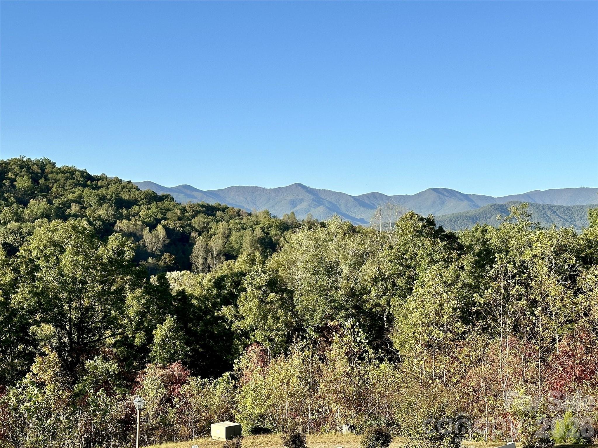 1120 Jacobs Branch Road Franklin, NC 28734 - Photo 4 of 36 a view of a large body of water with a mountain in the background