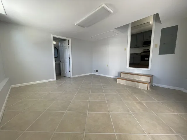 a view of an empty room and window