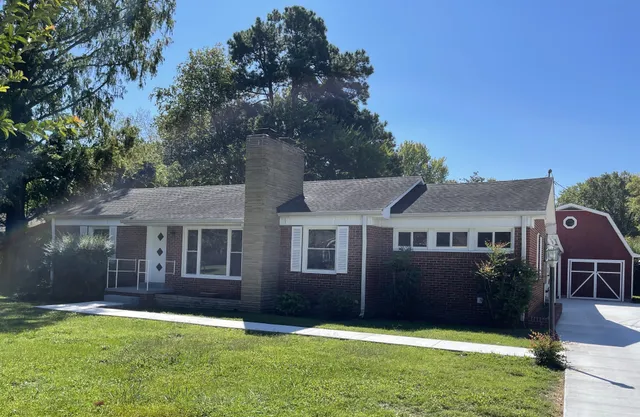 a view of a yard in front of a house