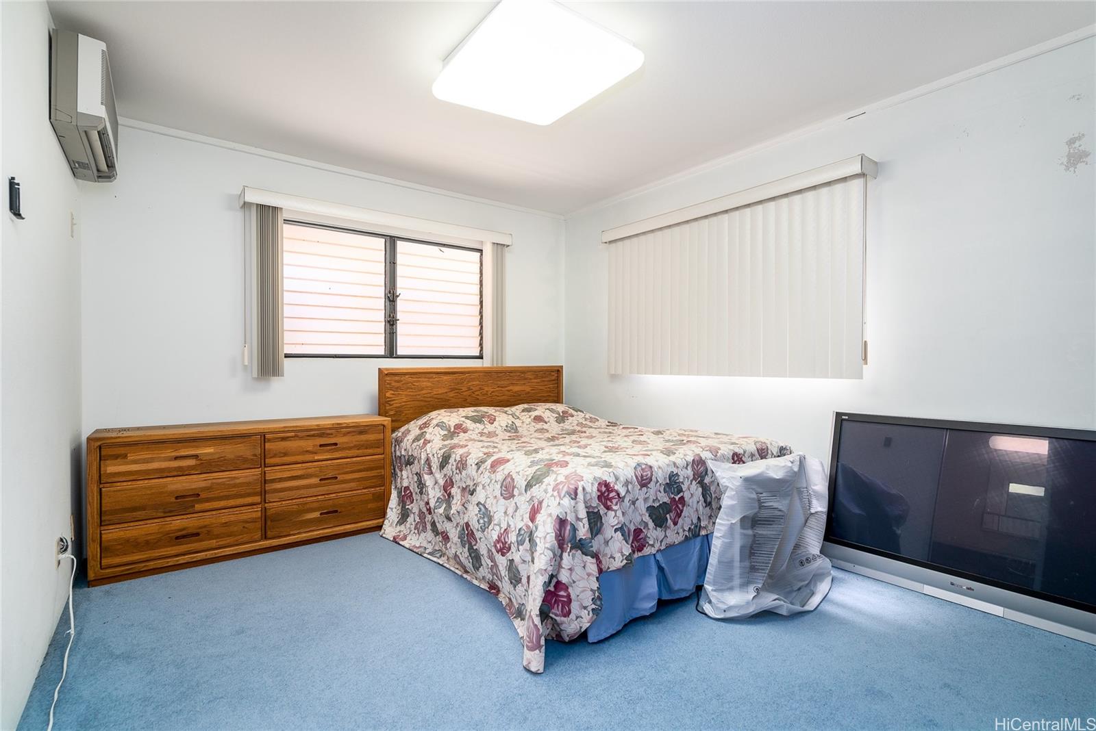 87-201 Paakea Road Waianae, HI 96792 - Photo 12 of 19 a bed room with a bed and a dresser