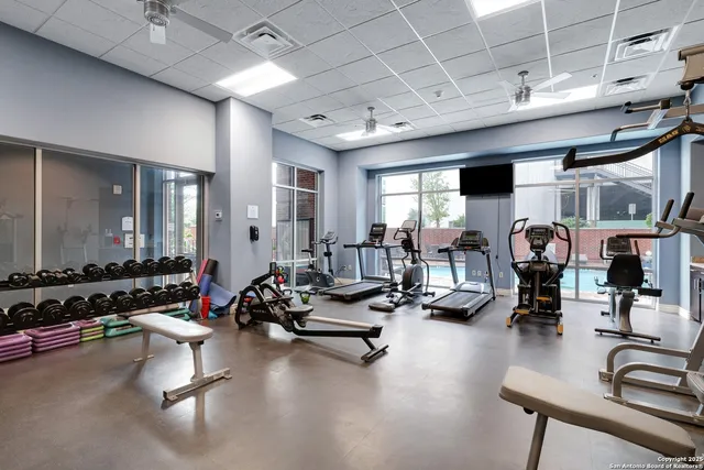 a room with lots of gym equipment