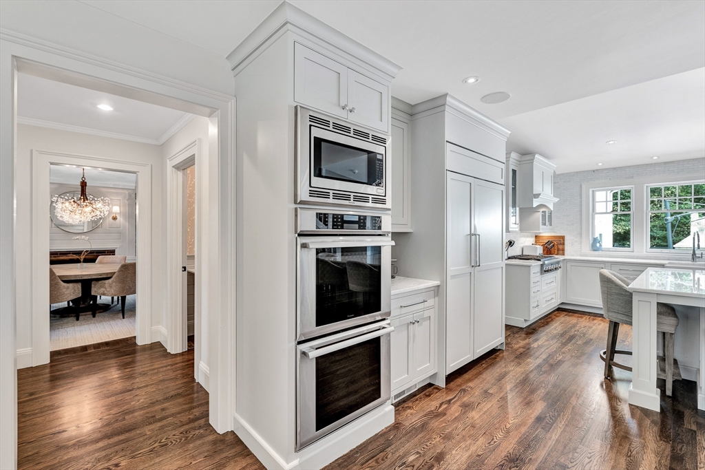 10 River Road Cohasset, MA 02025 - Photo 12 of 35 a kitchen with granite countertop a refrigerator and a stove top oven