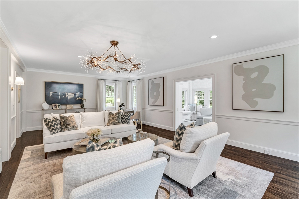 10 River Road Cohasset, MA 02025 - Photo 16 of 35 a living room with furniture and a chandelier