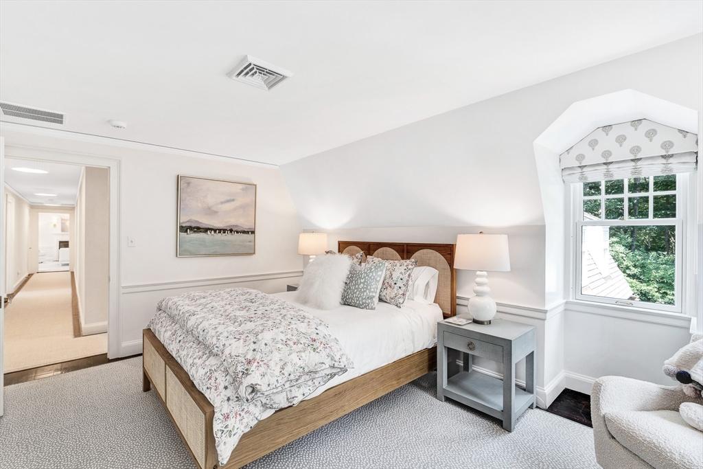 10 River Road Cohasset, MA 02025 - Photo 20 of 35 a bedroom with a bed and a couch