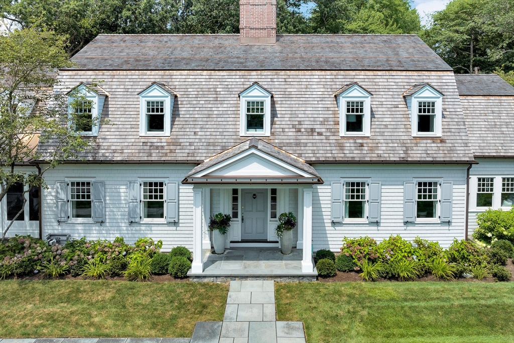 10 River Road Cohasset, MA 02025 - Photo 2 of 35 a front view of a house with garden