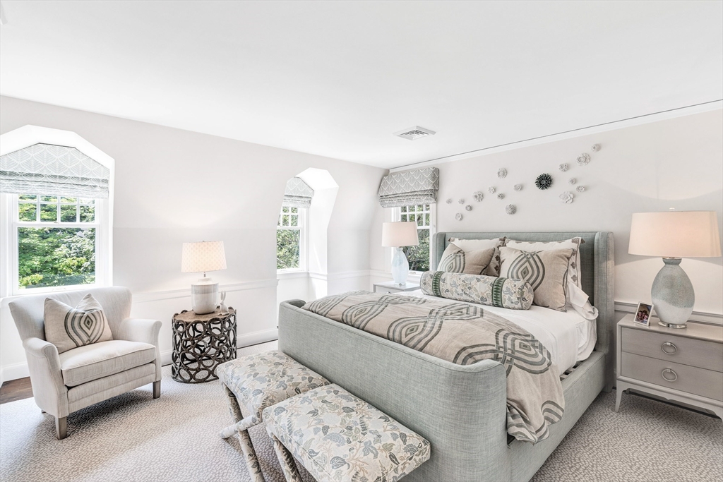 10 River Road Cohasset, MA 02025 - Photo 22 of 35 a large bedroom with a bed a couch and a large window