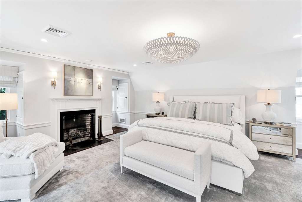 10 River Road Cohasset, MA 02025 - Photo 23 of 35 a bedroom with bed and a fireplace