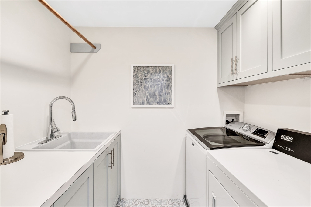 10 River Road Cohasset, MA 02025 - Photo 27 of 35 a kitchen with sink a stove and cabinets
