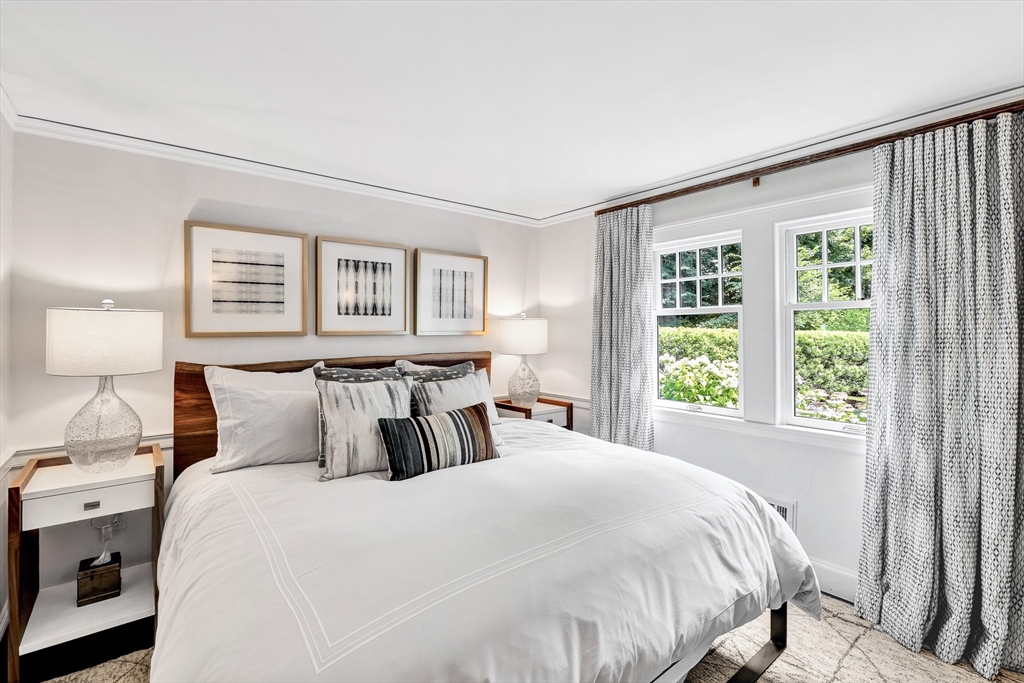 10 River Road Cohasset, MA 02025 - Photo 28 of 35 a bedroom with a large bed and a window
