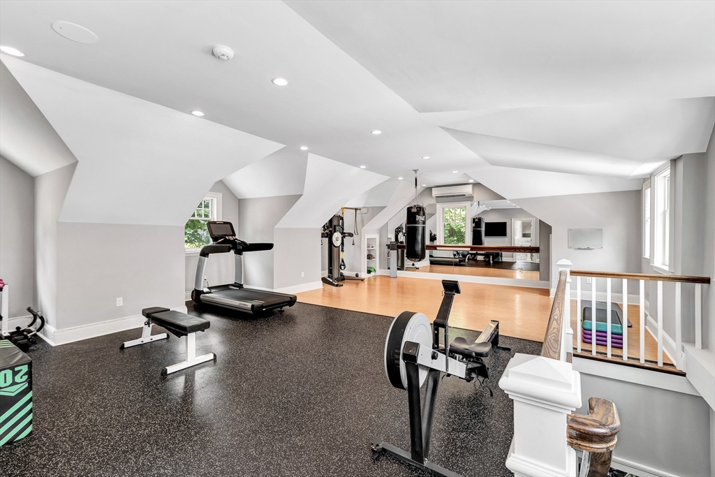 10 River Road Cohasset, MA 02025 - Photo 32 of 35 a living room with furniture gym equipment and a view of kitchen