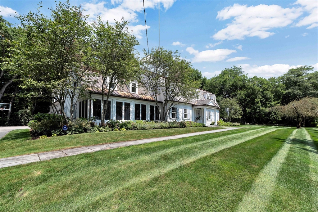 10 River Road Cohasset, MA 02025 - Photo 4 of 35 a front view of a house with a yard