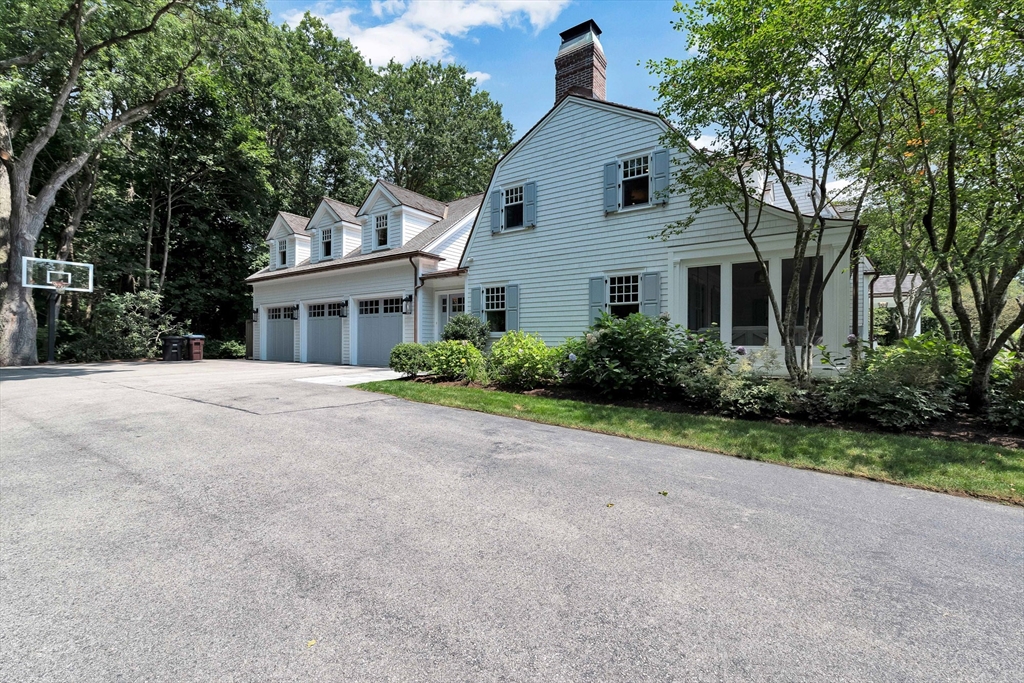10 River Road Cohasset, MA 02025 - Photo 5 of 35 a front view of a house with garden