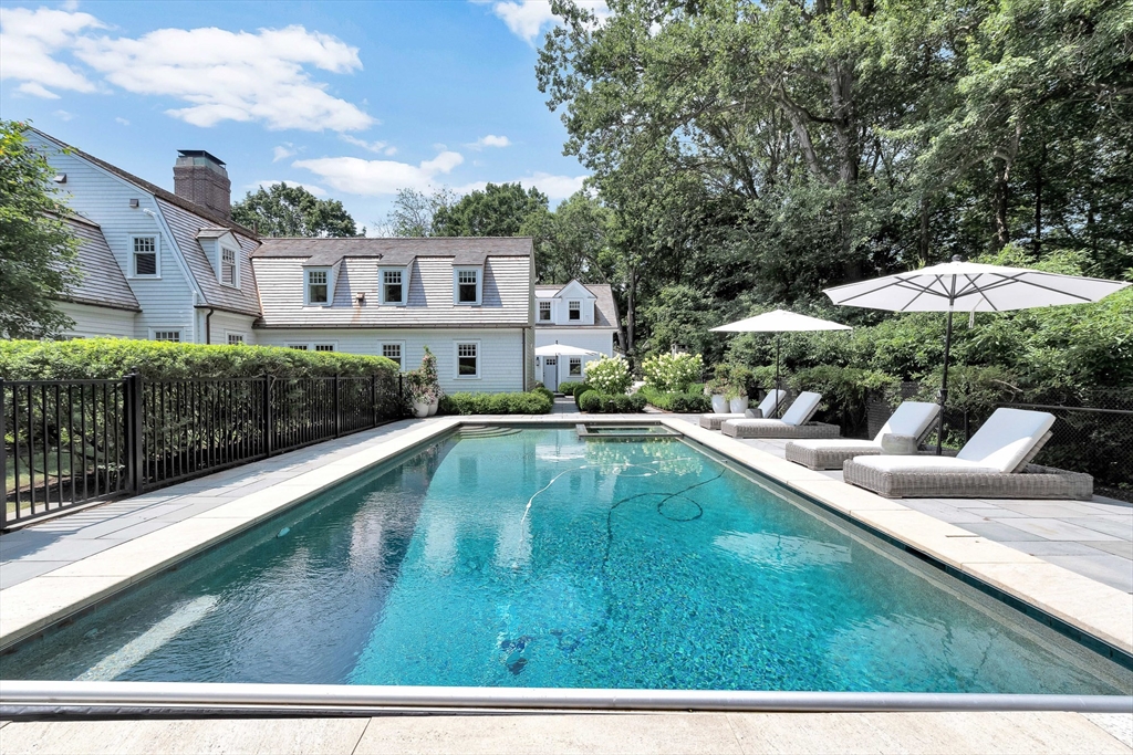 10 River Road Cohasset, MA 02025 - Photo 8 of 35 a view of swimming pool with lawn chairs and plants