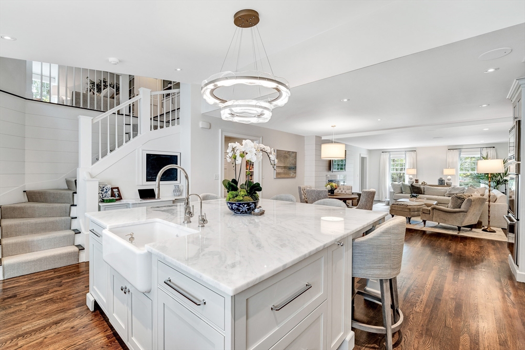 10 River Road Cohasset, MA 02025 - Photo 10 of 35 a large white kitchen with a stove a sink dishwasher and wooden cabinets with wooden floor