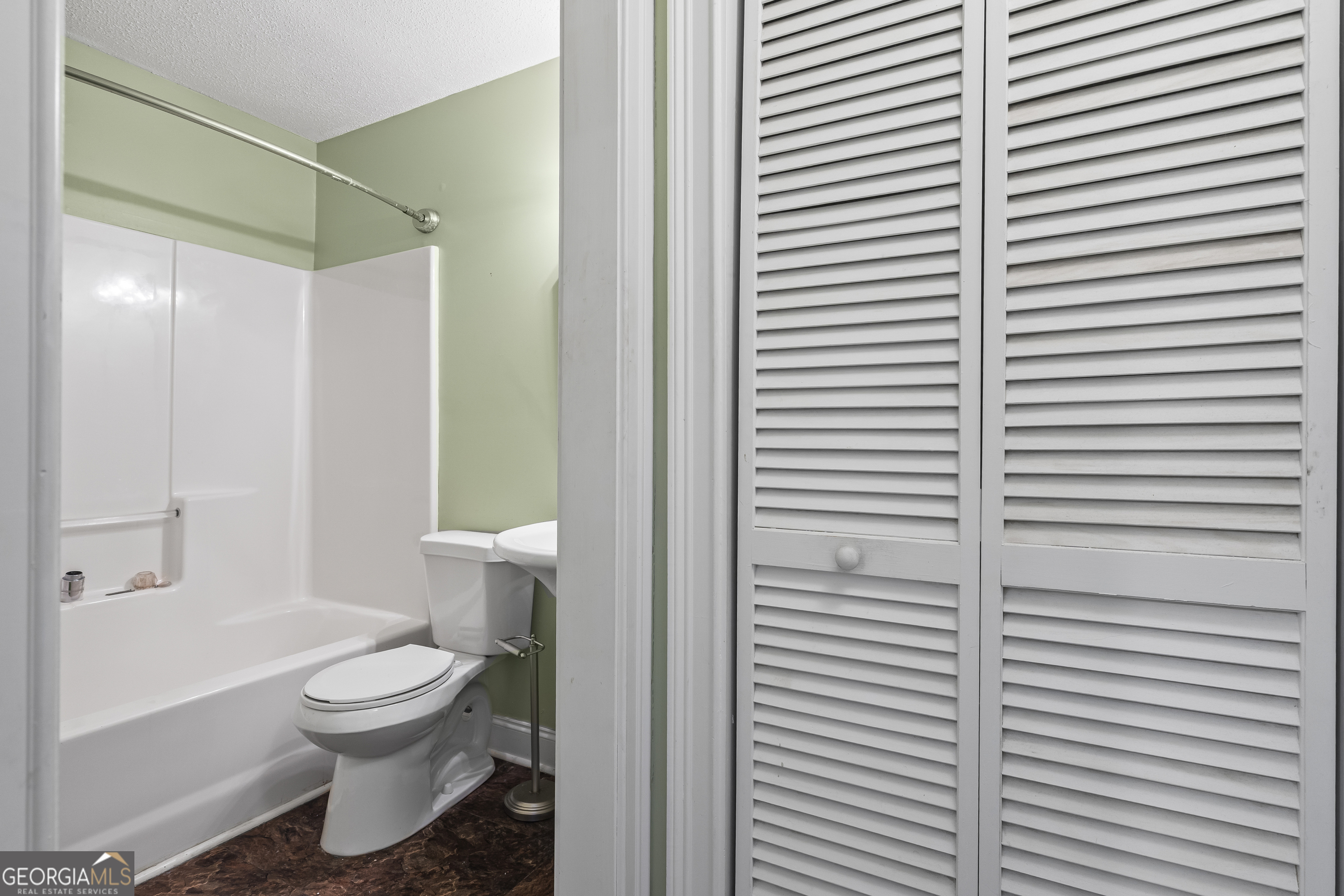 210 Blue Ridge Avenue Demorest, GA 30535 - Photo 23 of 74 a bathroom with a toilet and a shower