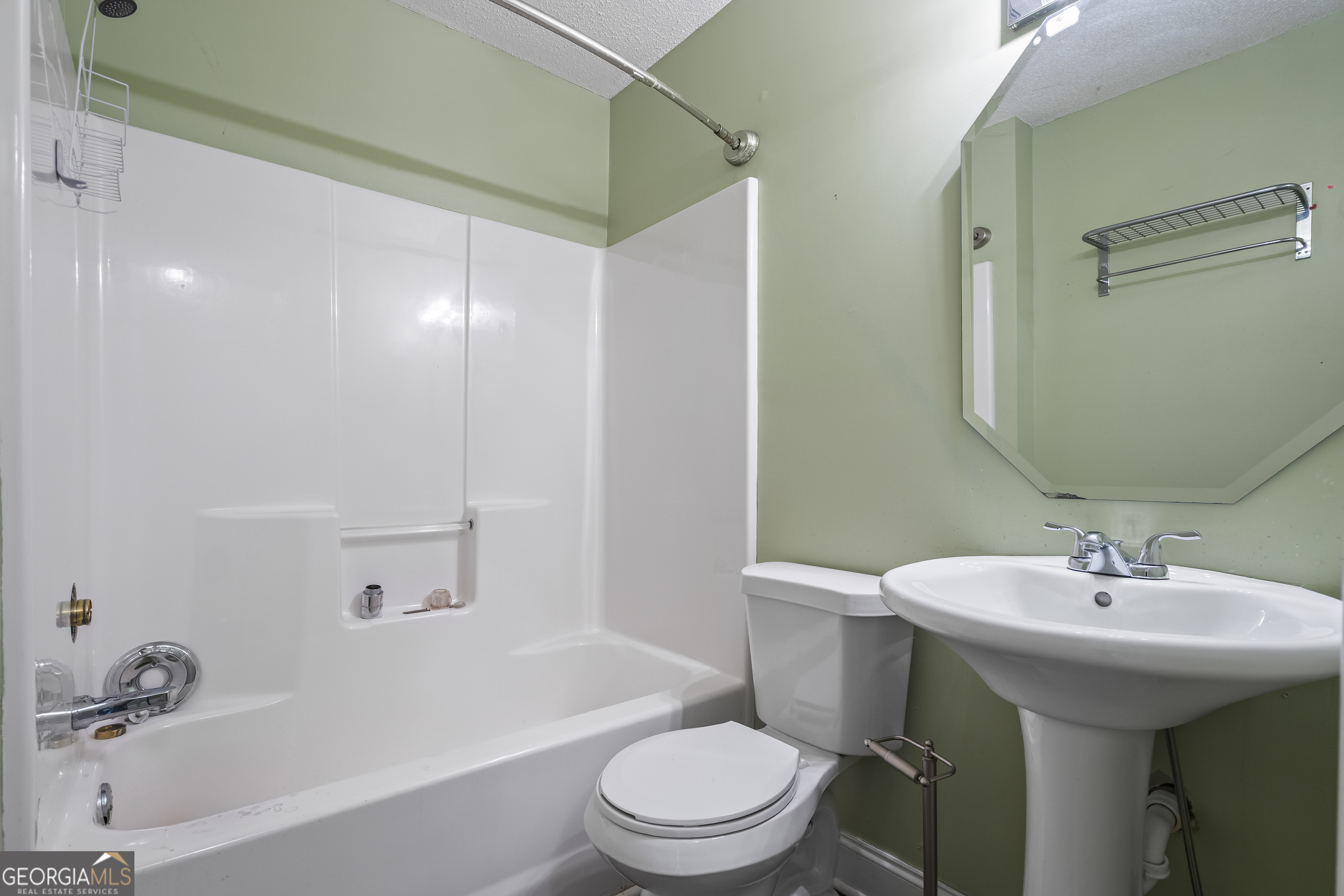 210 Blue Ridge Avenue Demorest, GA 30535 - Photo 24 of 74 a bathroom with a sink a toilet and shower