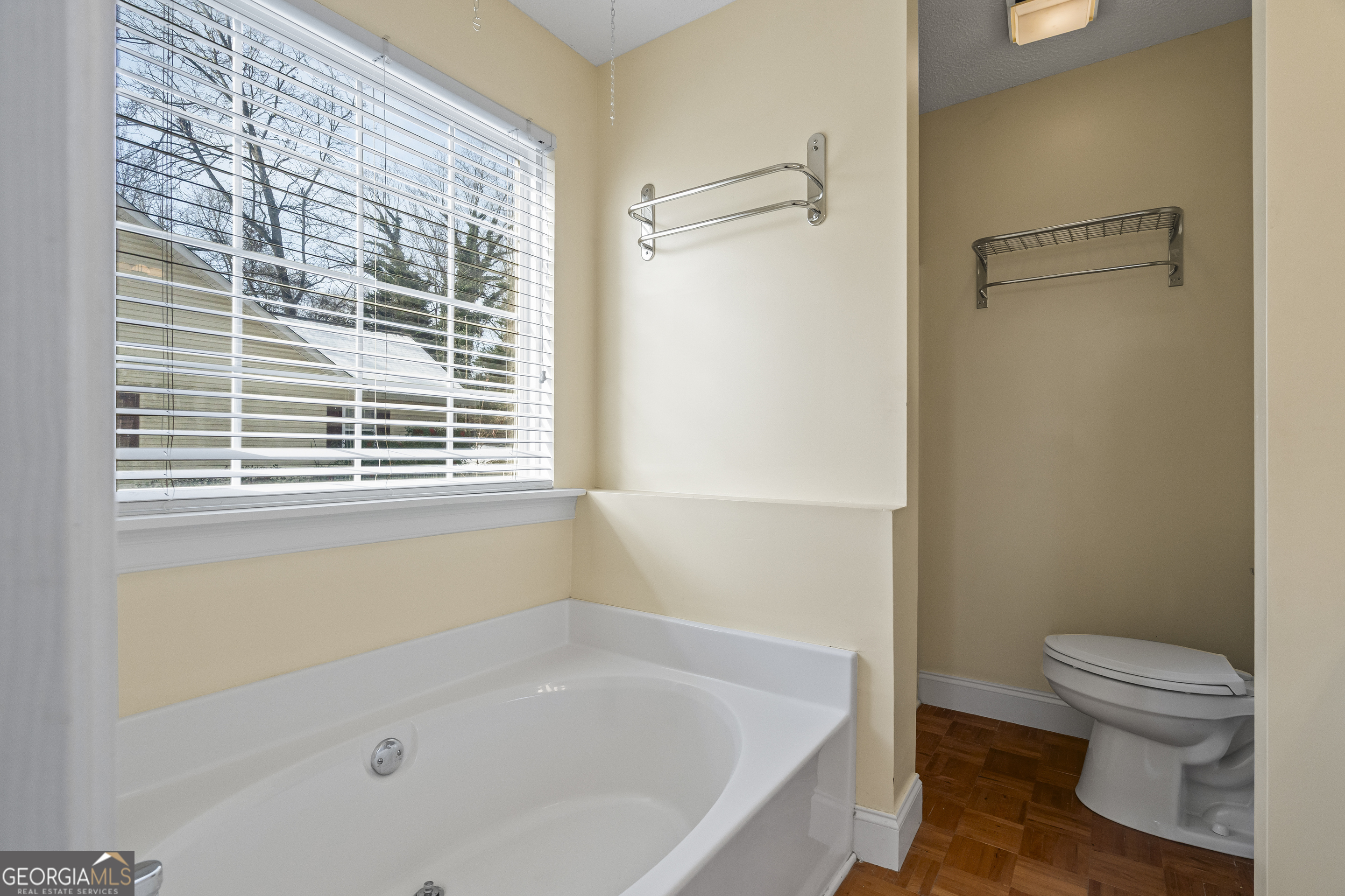 210 Blue Ridge Avenue Demorest, GA 30535 - Photo 29 of 74 a bath room with a toilet and a bath tub