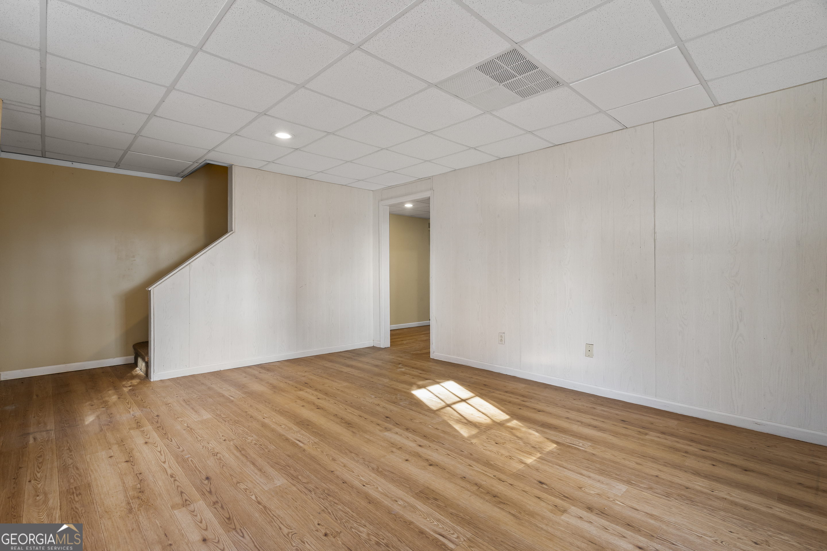 210 Blue Ridge Avenue Demorest, GA 30535 - Photo 33 of 74 a view of an empty room with wooden floor