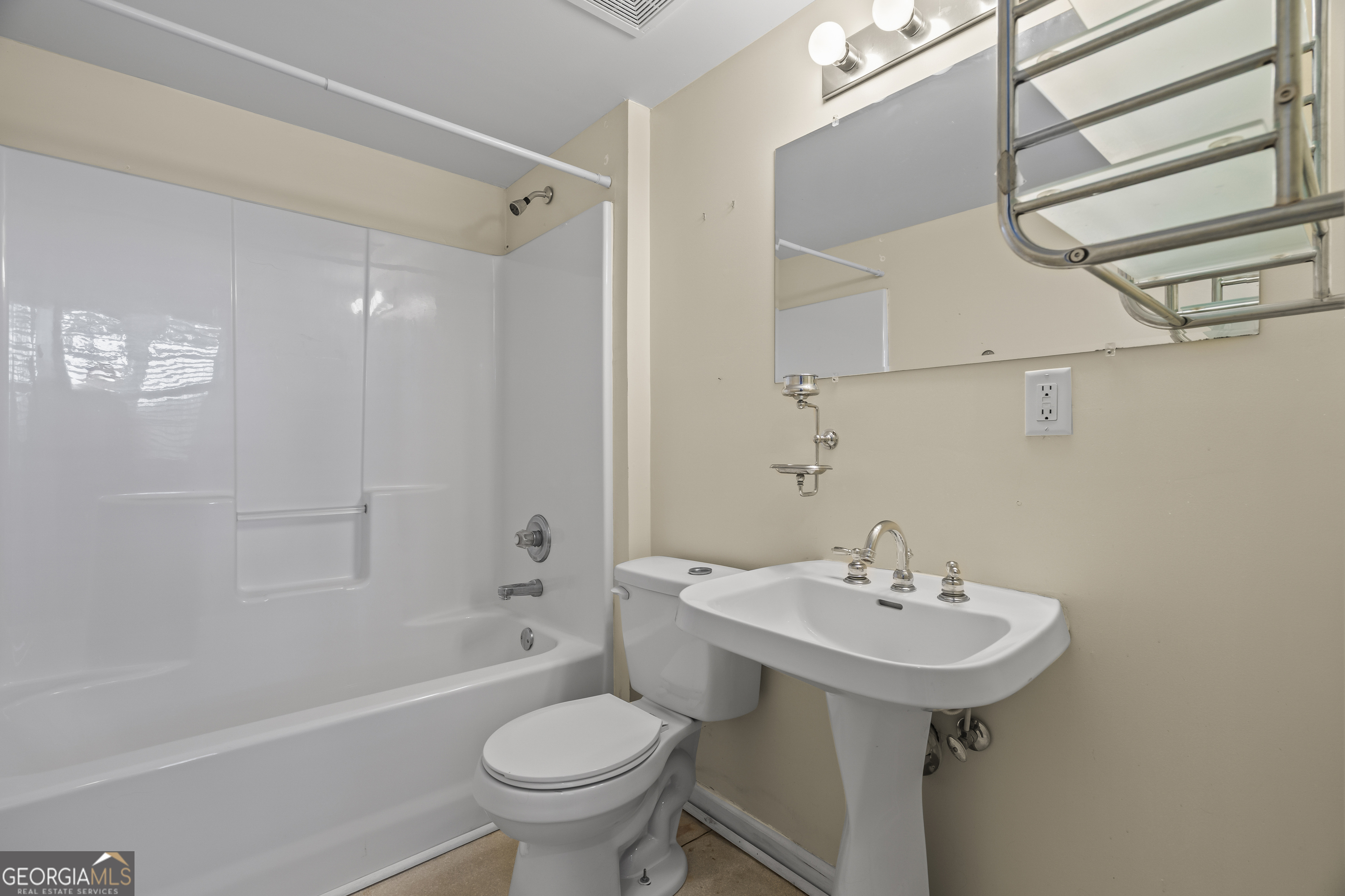 210 Blue Ridge Avenue Demorest, GA 30535 - Photo 39 of 74 a bathroom with a sink toilet and shower