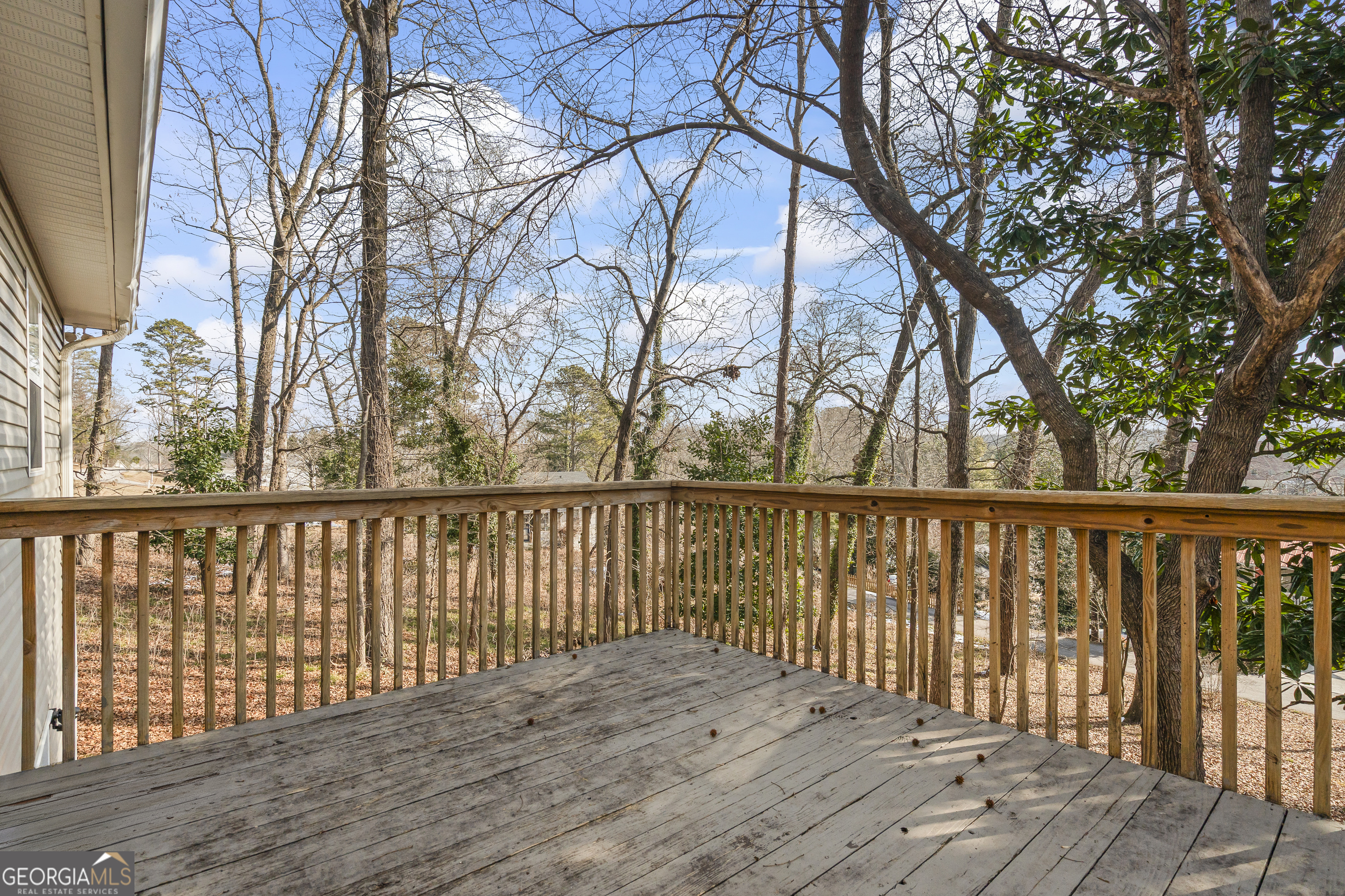 210 Blue Ridge Avenue Demorest, GA 30535 - Photo 48 of 74 a balcony with wooden floor and fence
