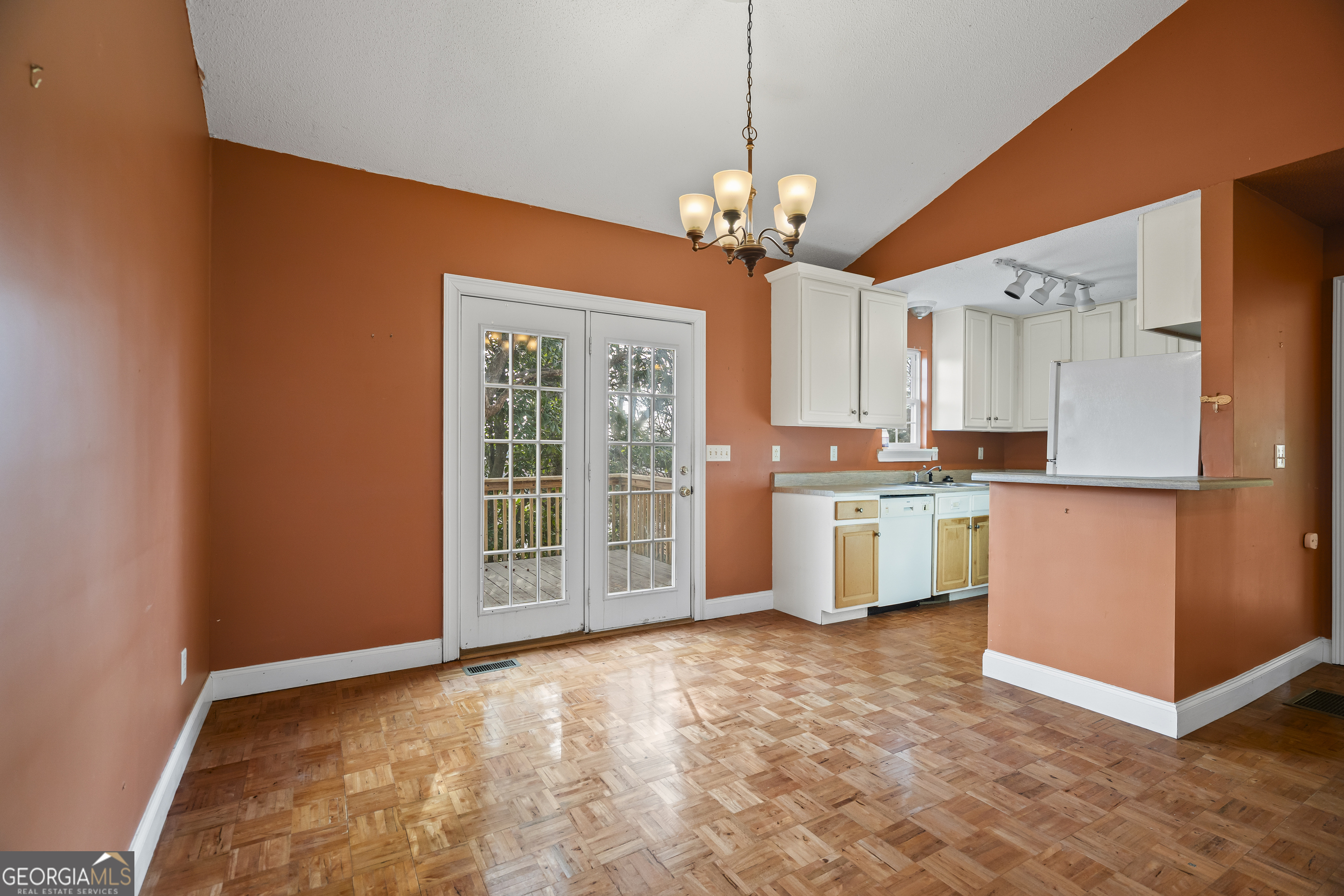 210 Blue Ridge Avenue Demorest, GA 30535 - Photo 9 of 74 a view of a kitchen with a sink and dishwasher a refrigerator with wooden floor