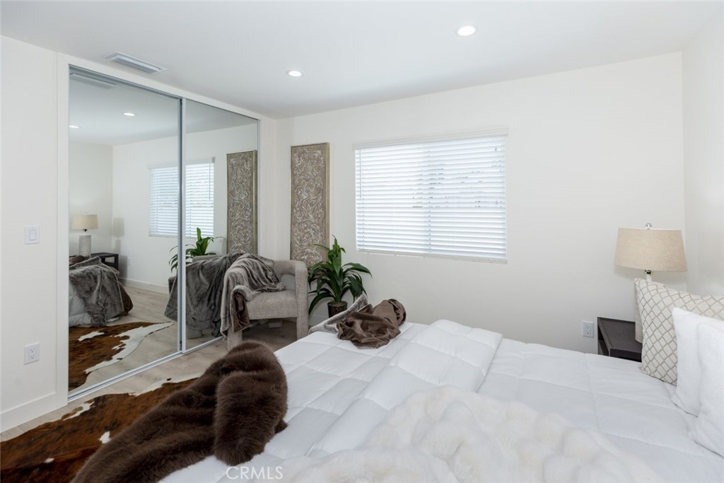 15254 Clymer Street Mission Hills, CA 91345 - Photo 14 of 26 a bedroom with furniture and a large window