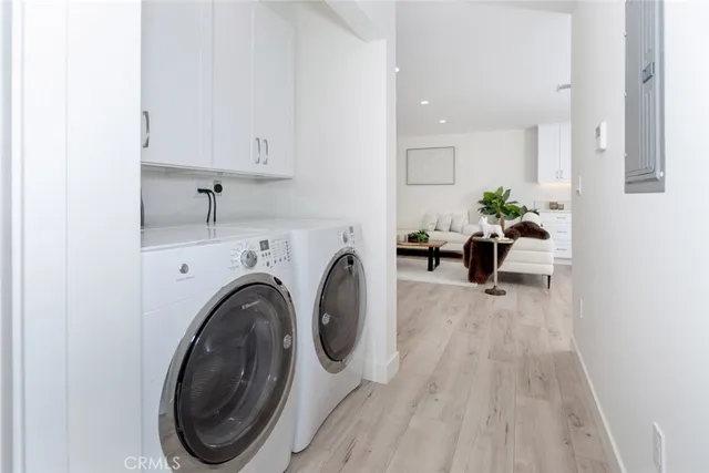 a hallway with a washer and dryer