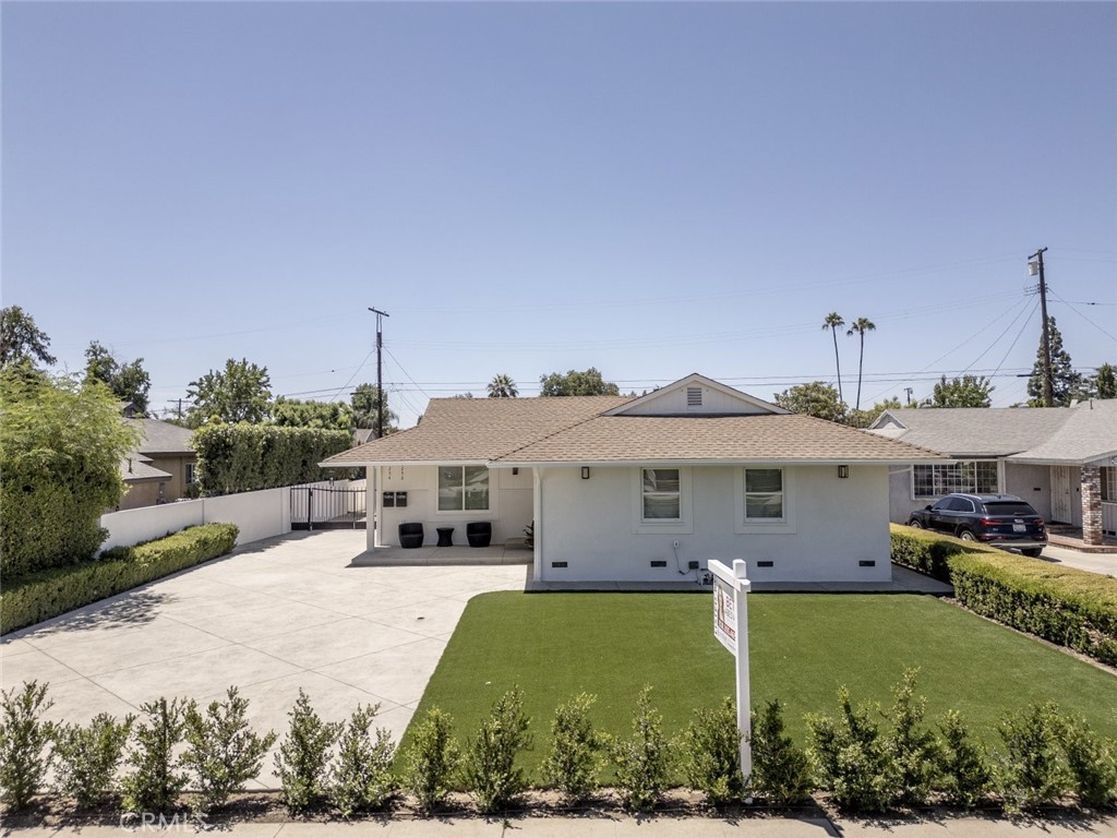 15254 Clymer Street Mission Hills, CA 91345 - Photo 19 of 26 a view of a house with a garden