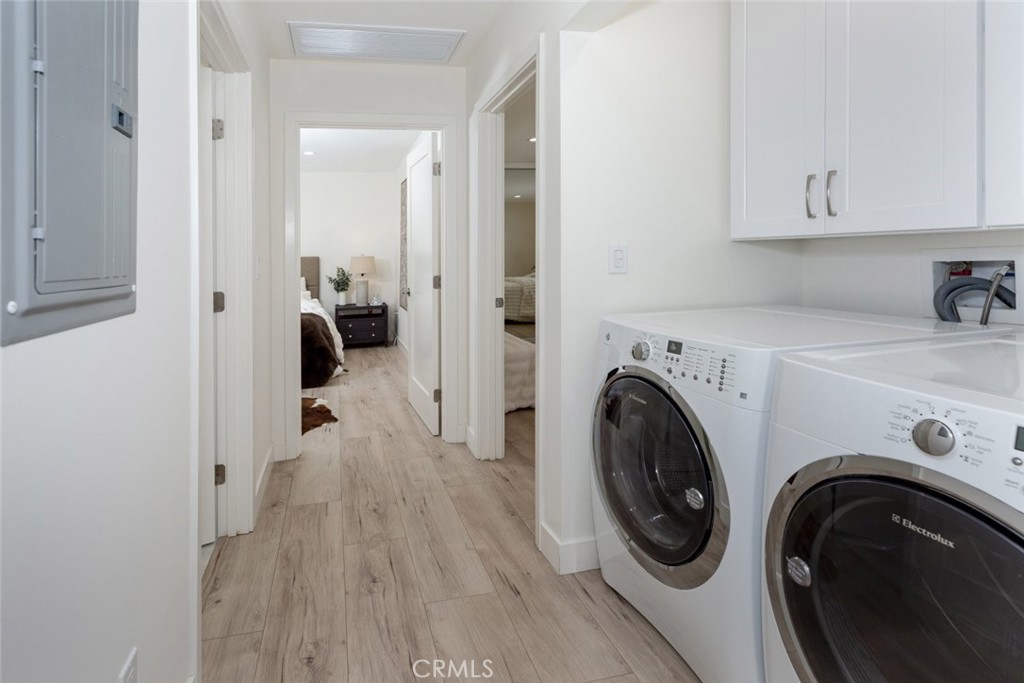 15254 Clymer Street Mission Hills, CA 91345 - Photo 8 of 26 a view of a storage and utility room with washer and dryer