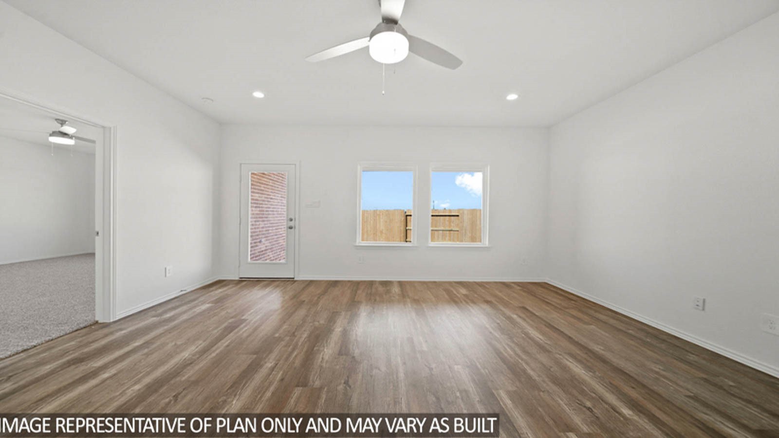 4225 Multnomah Fls Drive Conroe, TX 77303 - Photo 6 of 26 an empty room with wooden floor and windows