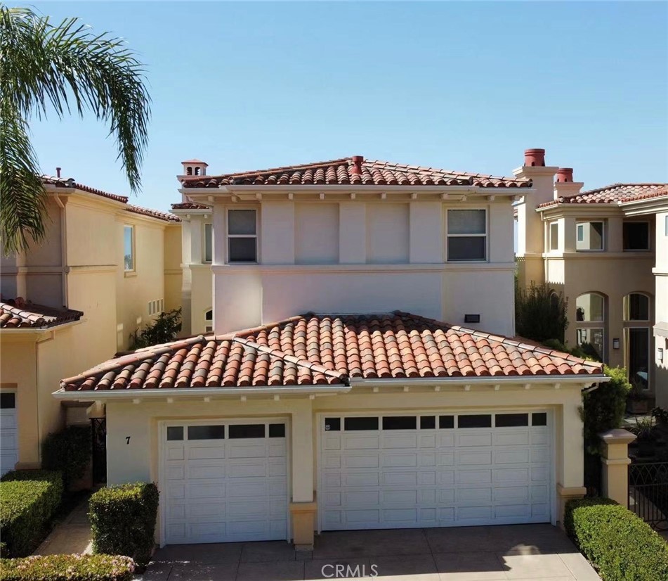 7 Stone Pine Drive Newport Coast, CA 92657 - Photo 1 of 1 a front view of a house with a balcony